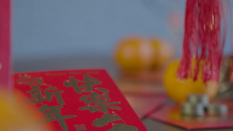 Sliding-Shot-Gliding-Over-Chinese-New-Year-Red-Packets-and-Coins