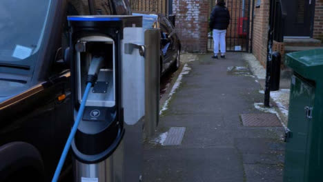 Tracking-Shot-Following-Cable-to-Reveal-On-Street-Electric-Car-Charging-Point-