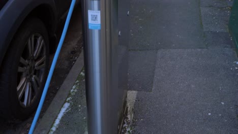 Tracking-Shot-Following-Cable-to-Reveal-On-Street-Electric-Car-Charging-Point-