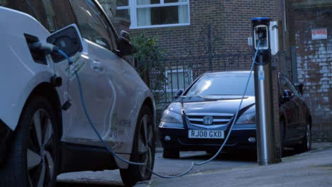 Low-Angle-Shot-of-Electric-Car-Charging-On-Street-