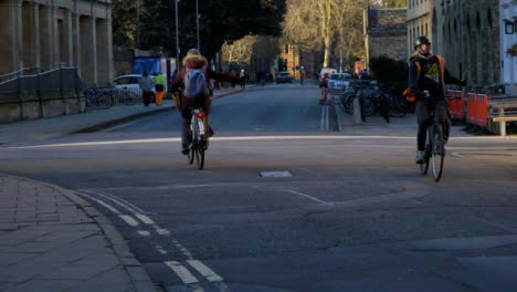 Handheld-Shot-of-Cyclists-Riding-Over-Mini-Roundabout-