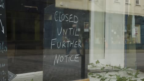 Close-Up-Shot-of-Closed-Until-Further-Notice-Sign-In-Shop-Window