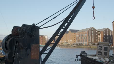 Tracking-Shot-Pulling-Away-from-Old-Industrial-Docks-Crane