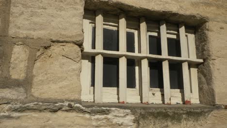 Close-Up-Shot-of-Old-Prison-Window-with-Bars-