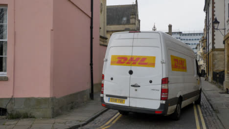 Tracking-Shot-of-Delivery-Van-Turning-Around-Corner-of-Old-Street