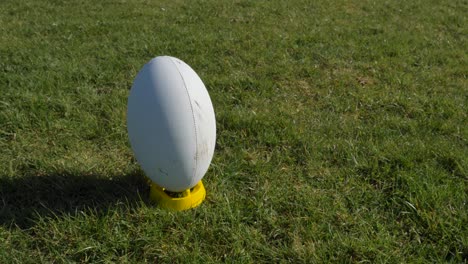 Medium-Shot-of-Rugby-Ball-Sitting-On-Tee