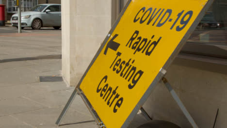 Panning-Shot-of-COVID-19-Test-Centre-Sign