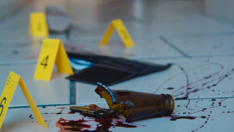 Pull-Focus-Shot-from-Bloody-Broken-Bottle-to-Shoe-at-Crime-Scene