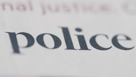 Sliding-Extreme-Close-Up-Shot-of-Newspaper-Police-Reform-Headline