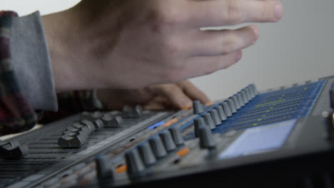 Pedestal-Shot-Revealing-Sound-Mixers-Hands-Gesturing-to-Musicians-Off-Screen