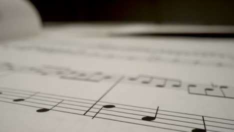 Tracking-Shot-Over-Music-Bars-On-the-Page-of-Music-Sheet-Book