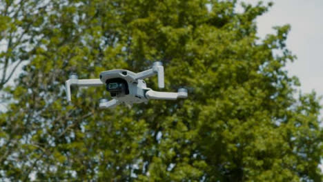 Low-Angle-Shot-Looking-Up-at-DJI-Mini-2-Drone-Hovering-