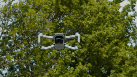 Tracking-Shot-Following-DJI-Mini-2-Drone-Flying-Through-Air
