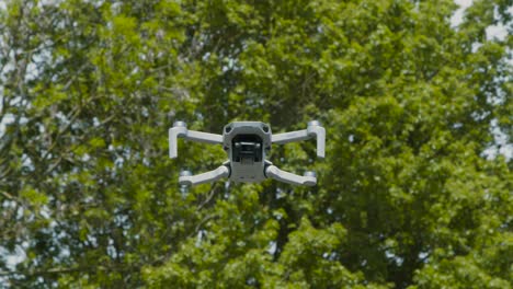 Tracking-Shot-Following-DJI-Mini-2-Drone-Flying-Through-Air
