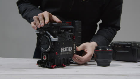 Wide-Shot-of-Person-Preparing-RED-Dragon-Cinema-Camera-for-Filming-Part-1-of-2