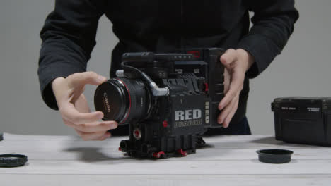 Wide-Shot-of-Person-Preparing-RED-Dragon-Cinema-Camera-for-Filming-Part-2-of-2