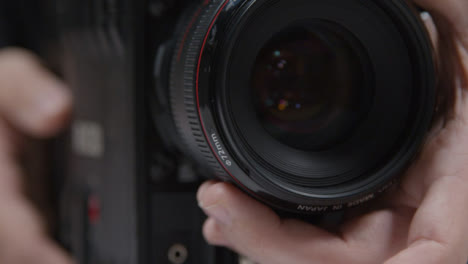 Close-Up-Shot-of-Person-Adjusting-Focus-On-Lens
