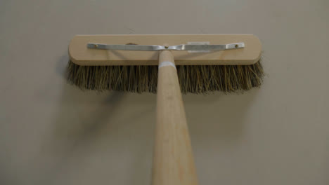 POV-Shot-of-Broomstick-Sweeping-Floor