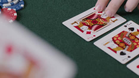 High-Angle-Shot-of-Turn-Card-During-a-Poker-Game-and-Player-Betting