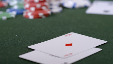 Extreme-Close-Up-Shot-of-Poker-Player-Turning-Over-Pocket-Aces