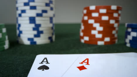 Sliding-Extreme-Close-Up-Shot-Approaching-Poker-Chips-and-Pocket-Aces
