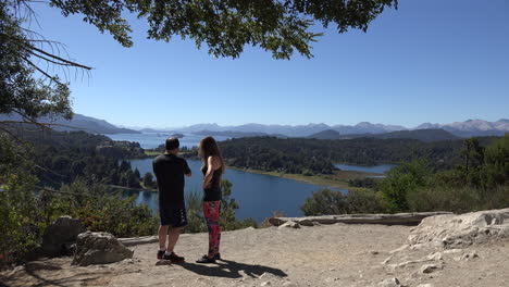 Argentina-couple-admire-lake-view
