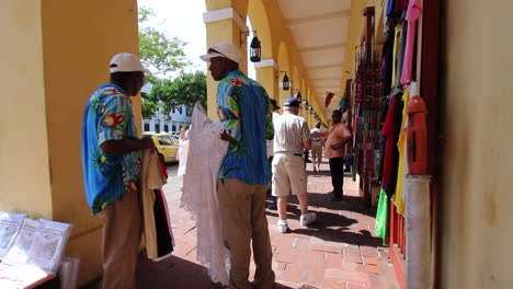 Cartagena-Colombia-men-on-sidewalk-with-tablecloth