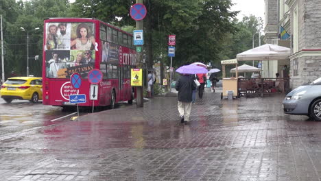 Tallinn-Estonia-red-bus-and-street-in-rain