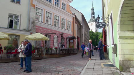 Tallinn-Estonia-street-scene-and-distant-church-steeple