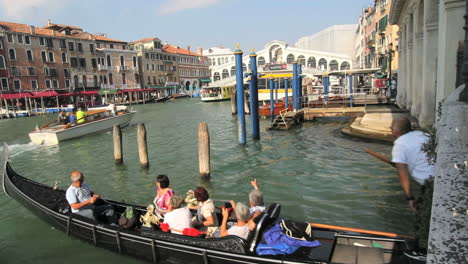 Venice-Italy-Grand-Canal-tourists-in-gondola-entering-Grand-Canal