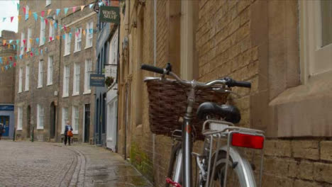 Close-Up-Shot-of-Bicycle-On-Quiet-Shopping-Street