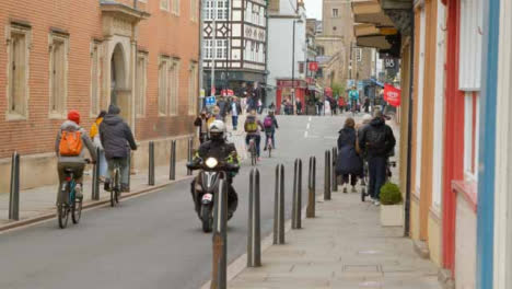 Tracking-Shot-Down-Busy-Street-with-Cyclists-and-Pedestrians