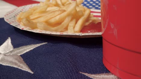 Sliding-Shot-Over-Paper-Plate-of-Fries-and-Ketchup