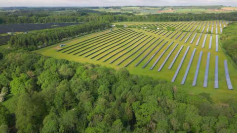 Drone-Shot-Flying-Over-Woodland-and-Solar-Field-