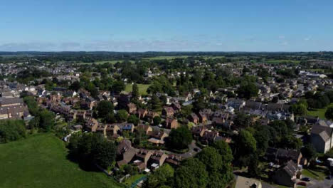 Drone-Shot-Tracking-Along-Rural-Footpath-and-Panning-Up-Revealing-Suburban-Neighbourhood