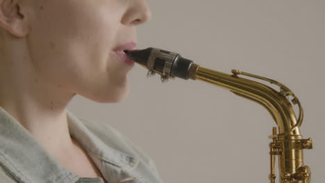 Close-Up-Shot-of-Model's-Mouth-as-She-Plays-Saxophone