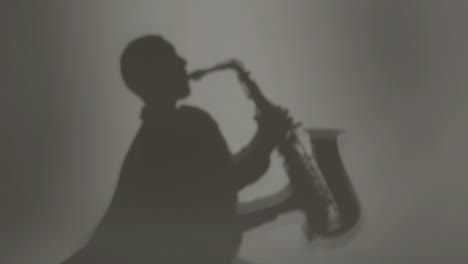 Medium-Shot-of-Saxophonist's-Shadow