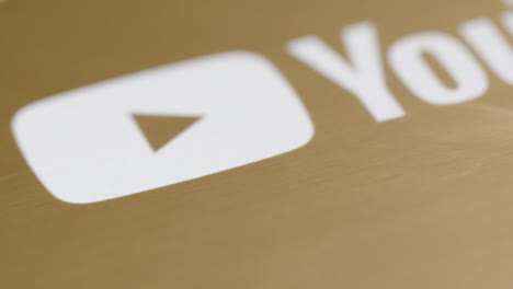 Extreme-Close-Up-Shot-of-YouTube-1,000,000-Subscriber-Plaque-Rotating-