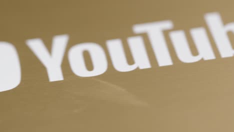Extreme-Close-Up-Shot-of-YouTube-1,000,000-Subscriber-Plaque-Rotating-