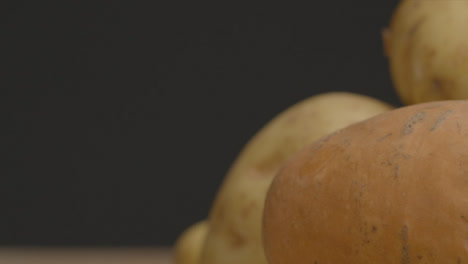 Sliding-Extreme-Close-Up-Shot-of-Assorted-Potato-Pile