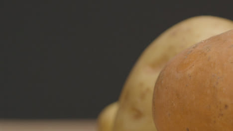 Sliding-Extreme-Close-Up-Shot-of-a-Pile-of-Assorted-Potatoes