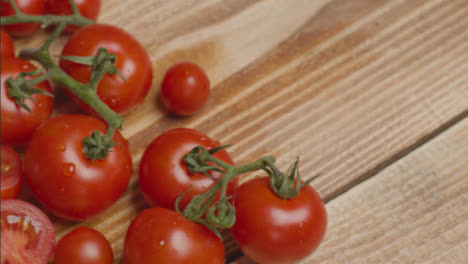 Close-Up-Shot-Panning-Over-Tomatoes-On-Rustic-Wooden-Table-