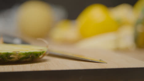 Close-Up-Shot-of-Kitchen-Knife-On-Chopping-Board