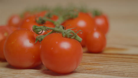 Close-Up-Shot-of-Tomatoes-On-Rustic-Wood-Table
