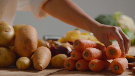 Tracking-Shot-of-Young-Adult-Woman-Slicing-Carrot