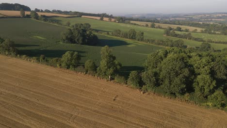 Drone-Shot-Flying-Away-from-Rural-Fields