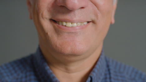 Portrait-Shot-of-a-Senior-Mans-Mouth-Smiling