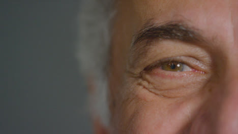 Close-Up-Shot-of-Senior-Mans-Eye-as-He-Smiles