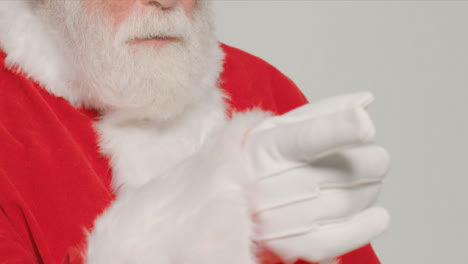 Close-Up-Shot-of-Santa-Pointing-Off-Camera