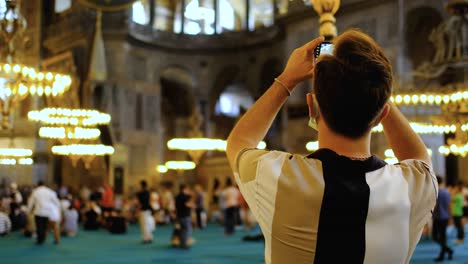 Close-Up-Shot-of-Young-Man-Taking-Pictures-Inside-Hagia-Sophia